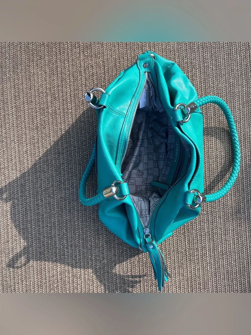 Liz Claiborne teal leather handbag with braided handles and tassel